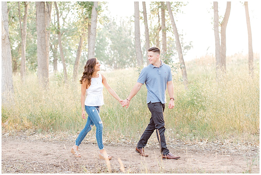 Couple walking in field at Chatfield State Park