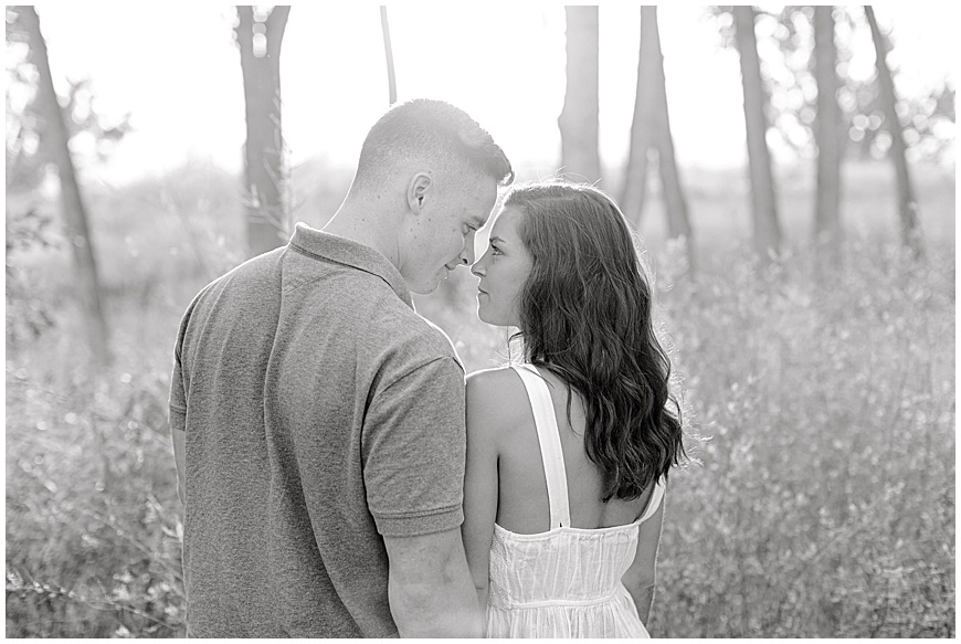 Black and White engagement photo of Couple in field at Chatfield State Park