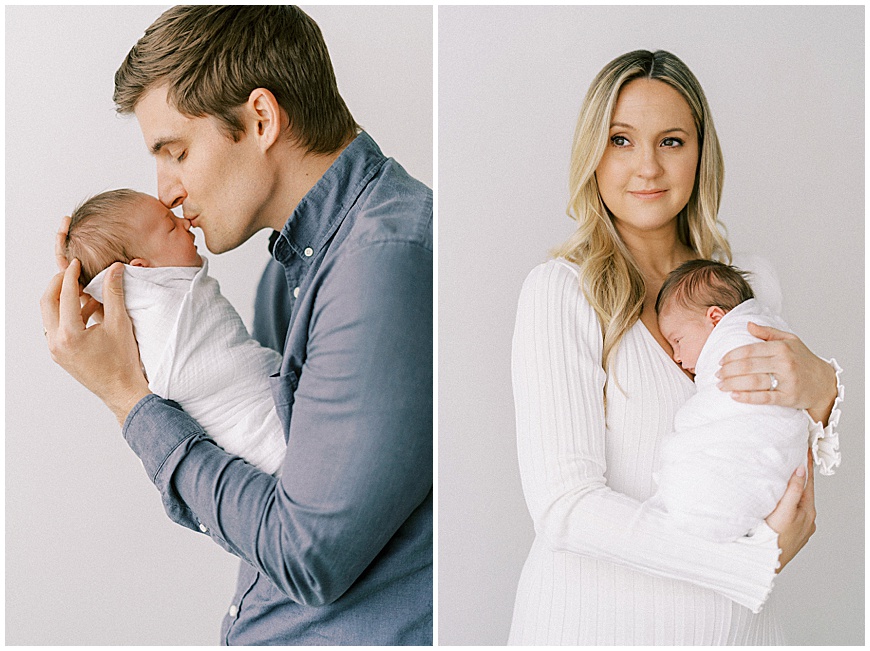 In studio newborn session with mom and dad holding baby.