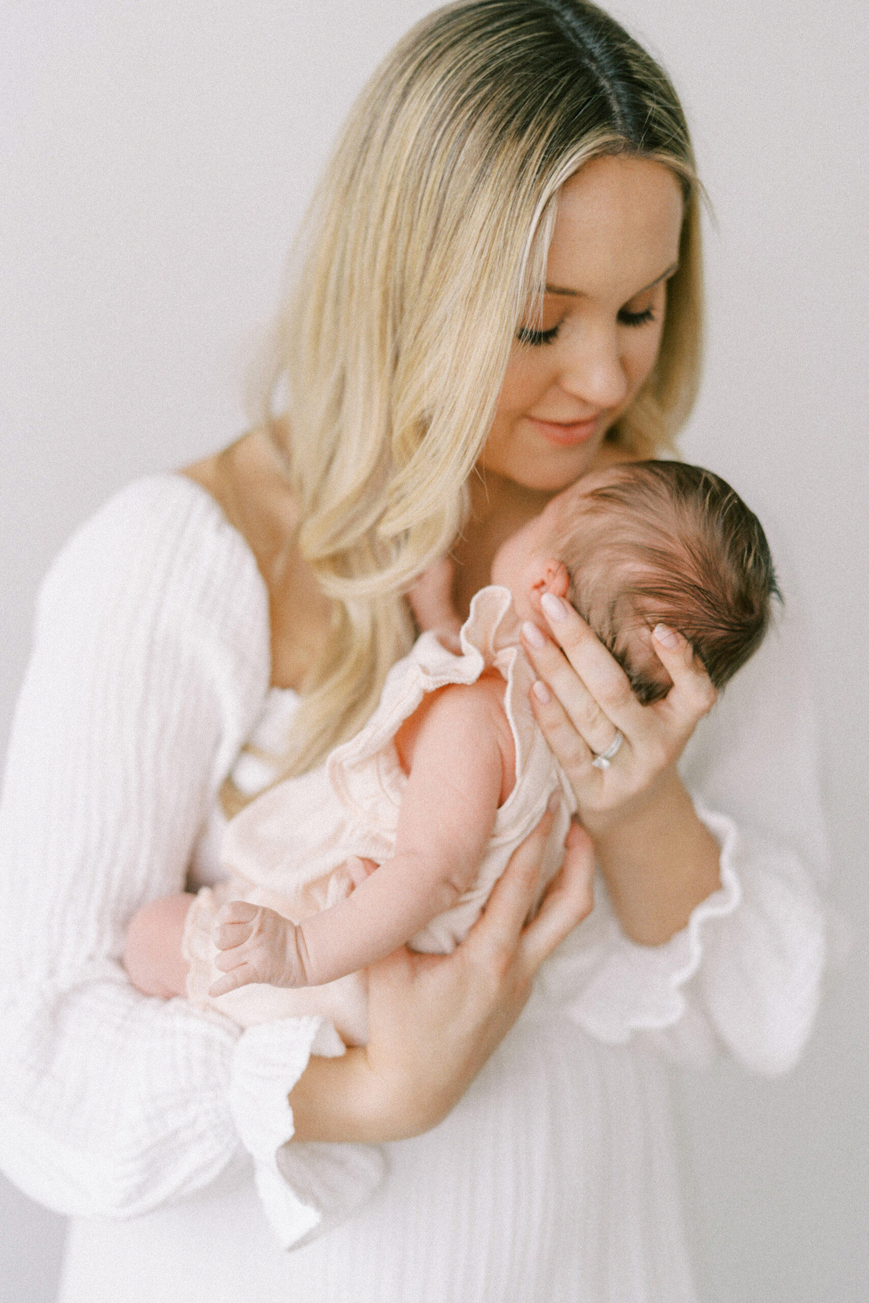 Newborn photography session featuring mom and baby.