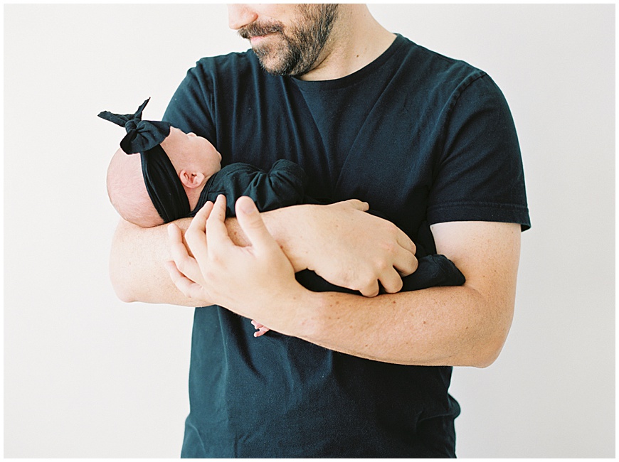 Father and newborn baby during newborn session