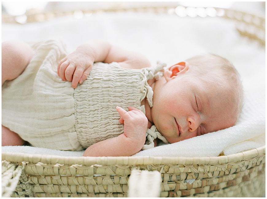 Image of Newborn Baby Girl in Crib: Newborn baby girl peacefully asleep in her crib, wrapped in a soft swaddle.