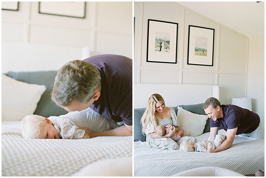 Parents with Newborn and Sibling: Loving Parents cradling their newborn baby girl and their excited young sibling, radiating joy and connection.